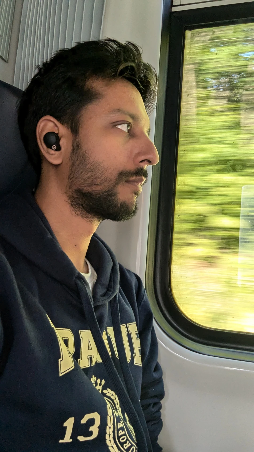 Ashish Dubey looking through a train window
