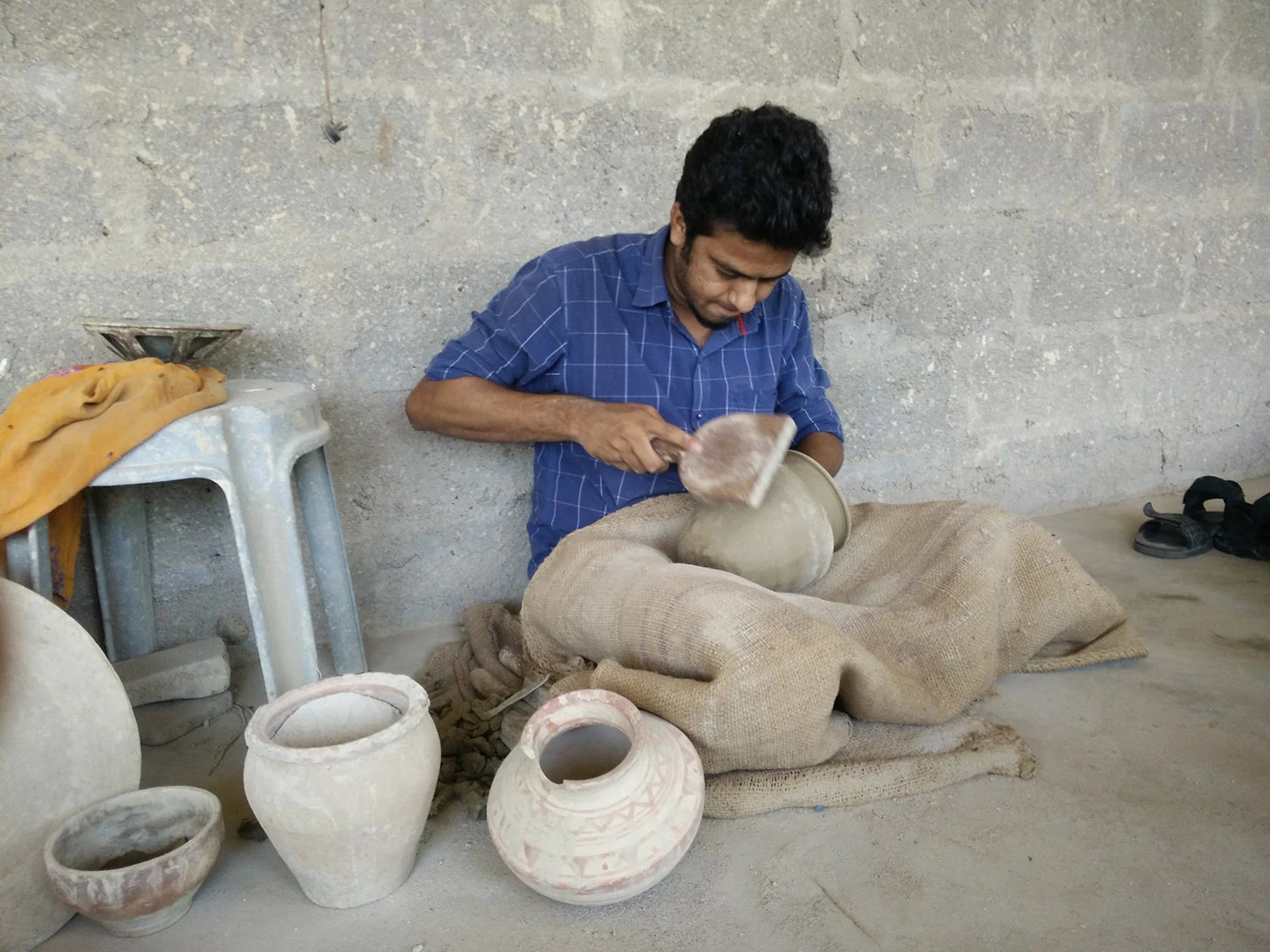 Bhargav Shaping up a clay pot